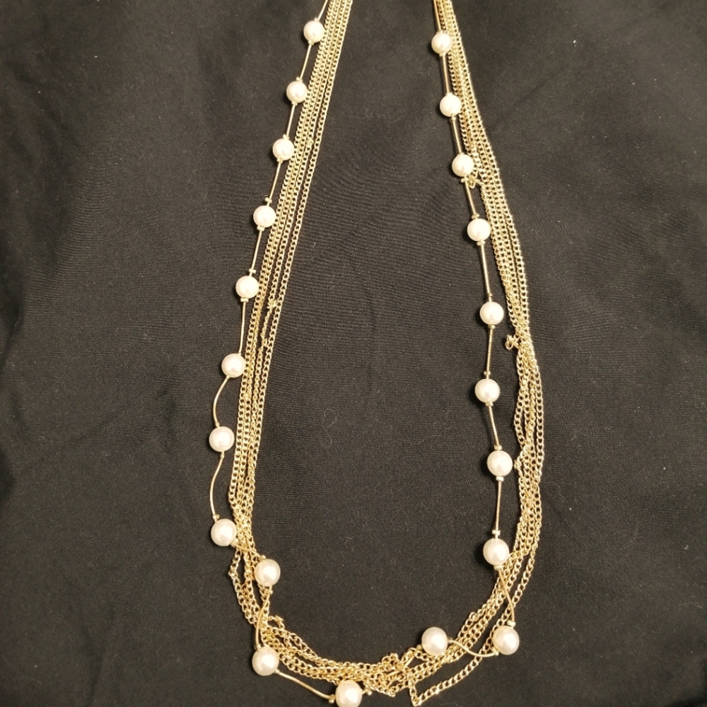 Gold with white bead necklace.